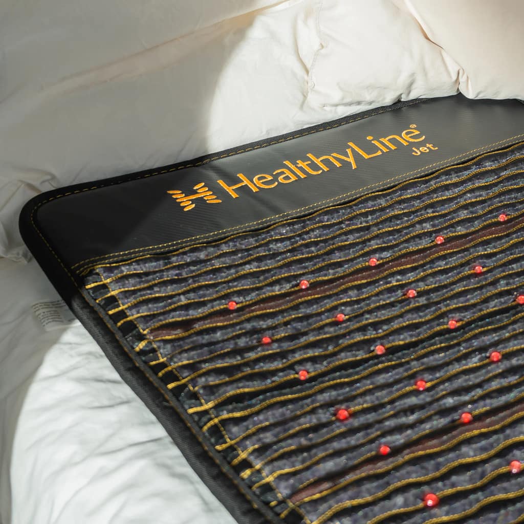 Close-up of HealthyLine JET PEMF MiniMat top with logo and quality finish