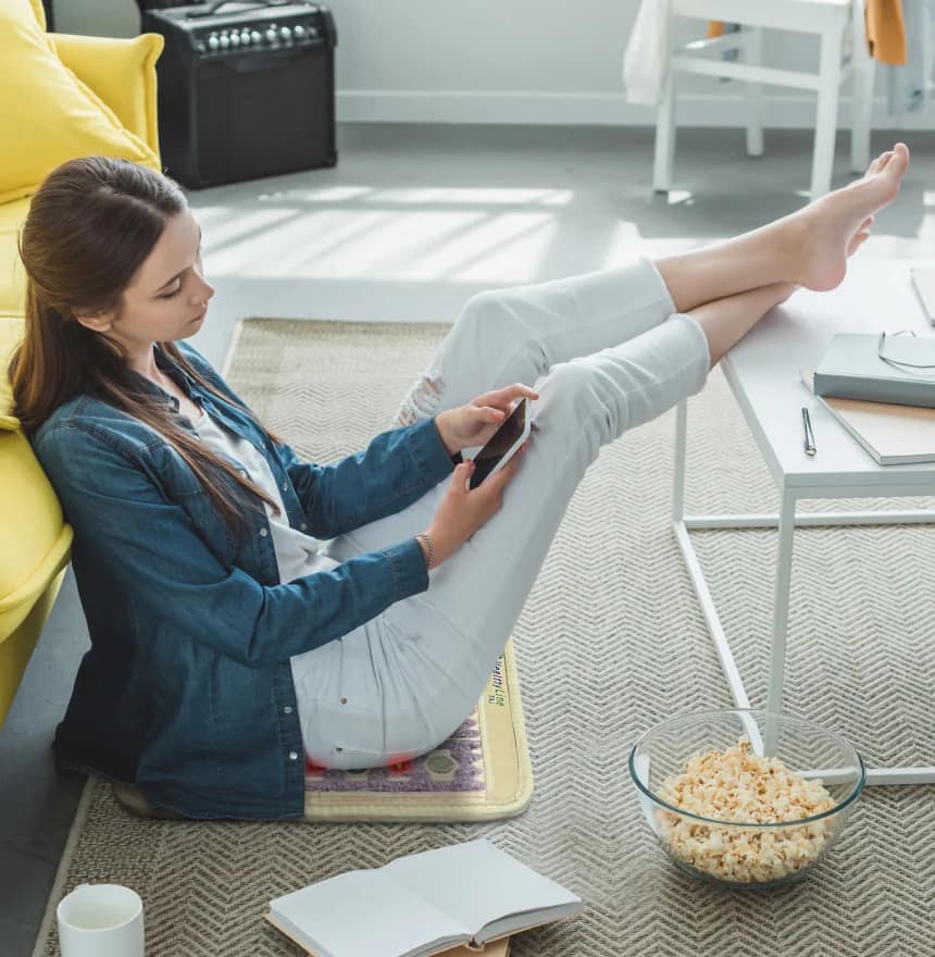 Using HealthyLine TAJ PEMF Pad on the floor for lower back and circulation support