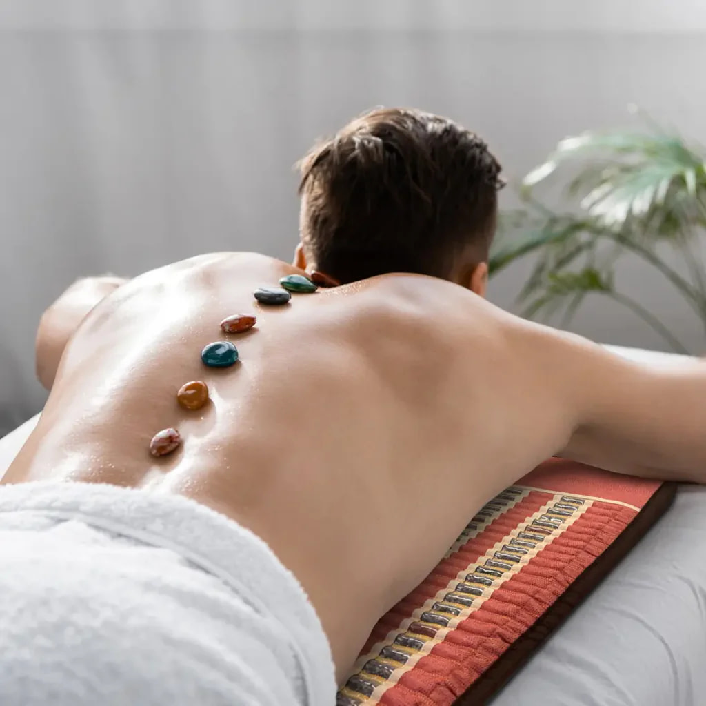 Full-body hot stone therapy with crystals on the HealthyLine TAO PEMF infrared ma