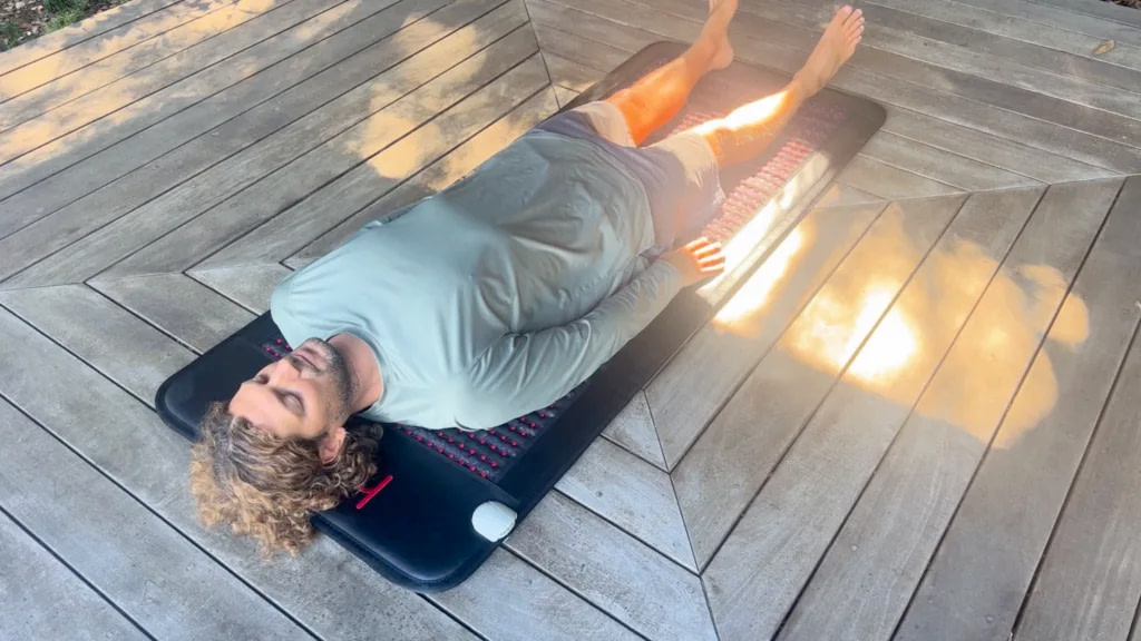 Marco getting PEMF therapy on the Hooha Mat