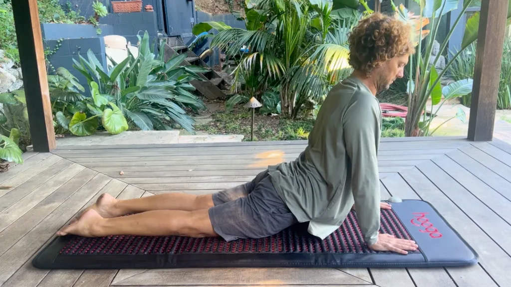 Marco performing yoga position on the Hooga PEMF Mat