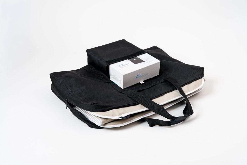 NeoSurround mat carry bag with a separate smaller bag for the room device