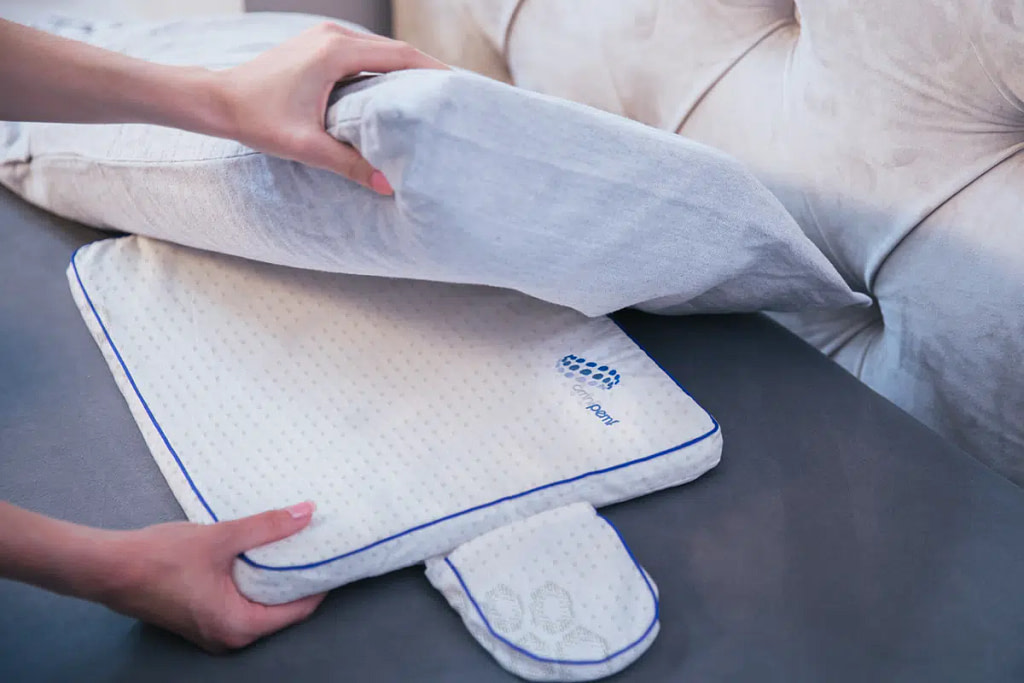 NeoRhythm pad placed under pillow to enhance sleep quality