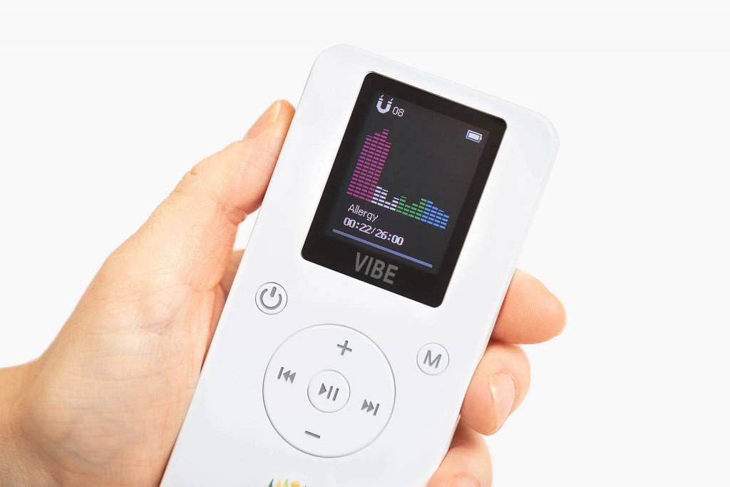 Resona Vibe pocket PEMF device held in hand to show its compact size