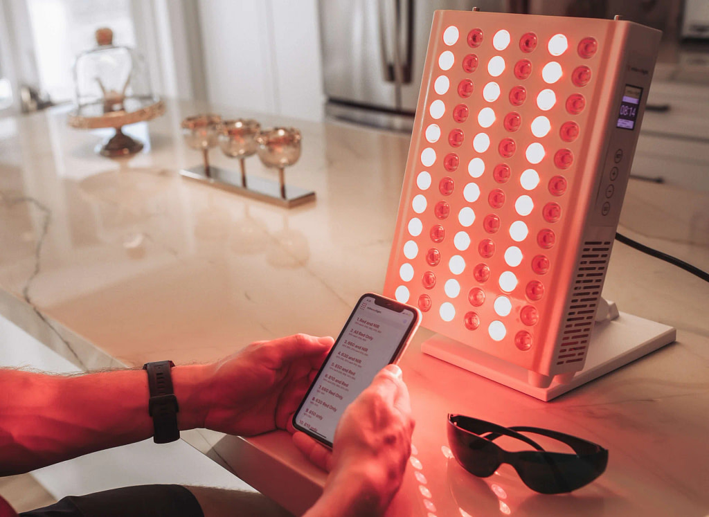 Mito red light panel review: a phone running the Mito Red Light app in front of the panel