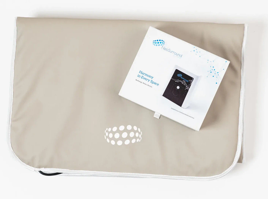 NeoSurround mat PEMF system folded next to its retail box