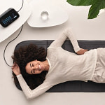 Woman lying on the Bemer EVO mat