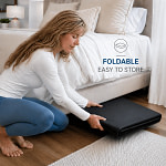 Woman putting the folded Grooni ma under the bed for storage