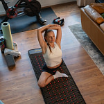Woman doing a yoga sessions on a JET Mat