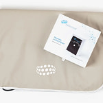 NeoSurround mat PEMF system folded next to its retail box