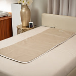 OmniPEMF NeoSurround Mat placed on a bed