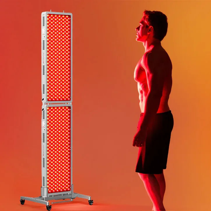 Man using BestQool PRO 300 for front body near-infrared light therapy session at home