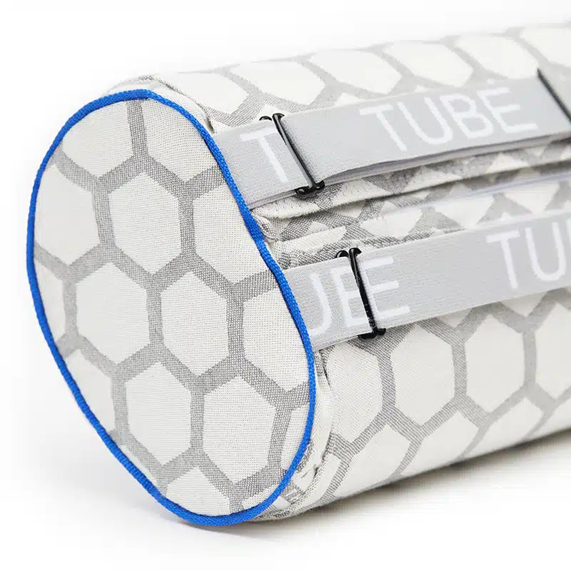 Straps on NeoRhythm Tube pillow for neck lumbar positioning
