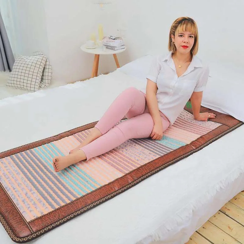 Relaxed woman using Phymat Gesmtones PEMF mat for wellness and energy flow