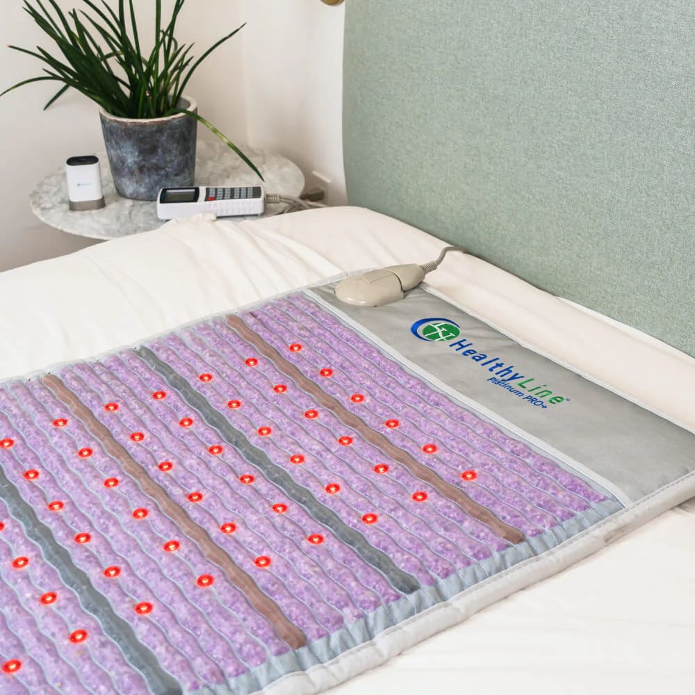 HealthyLine PEMF mat laid out on a bed for full-body overnight infrared therapy