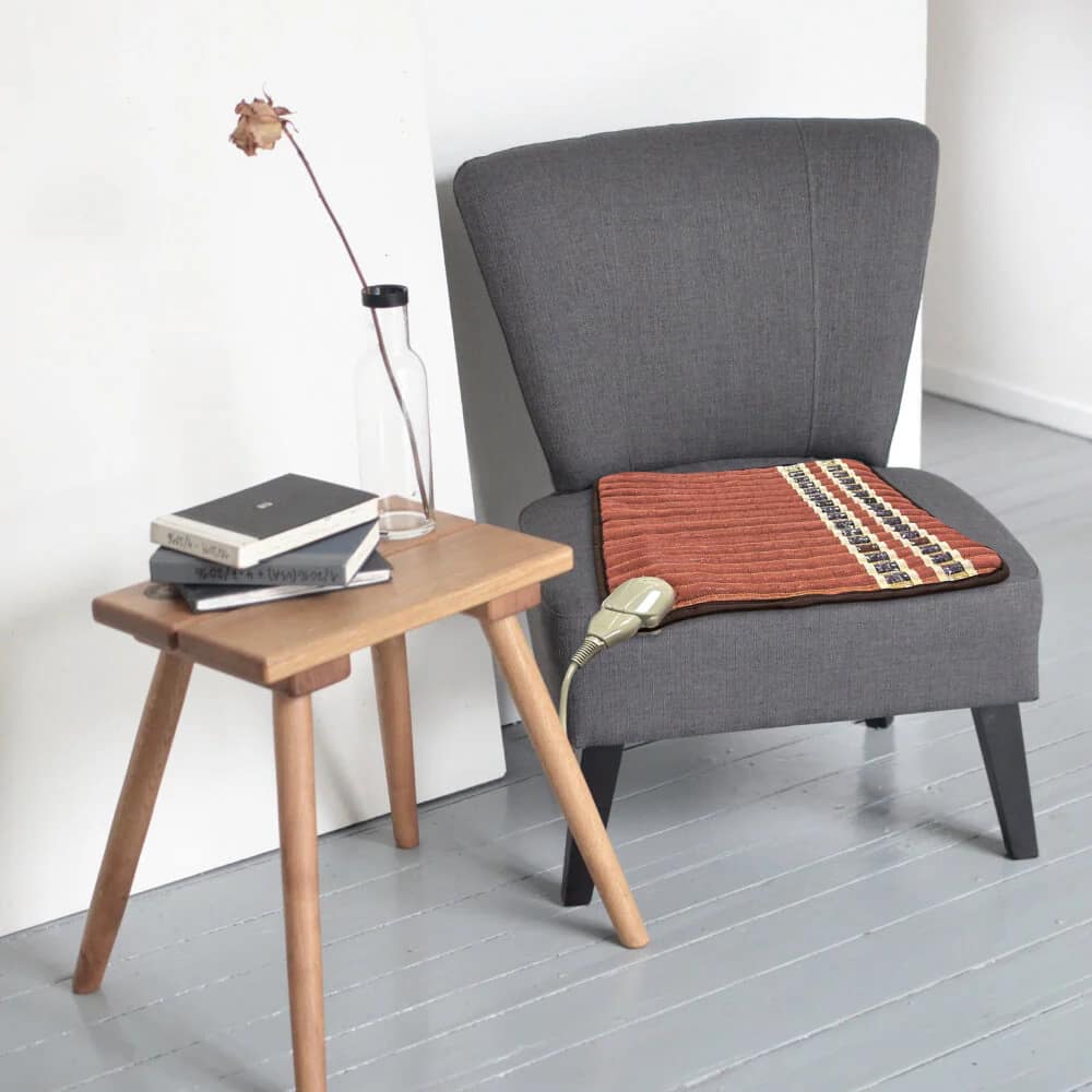 HealthyLine TAO PEMF Pad placed on a chair for seated PEMF, FIR, and photon light therapy