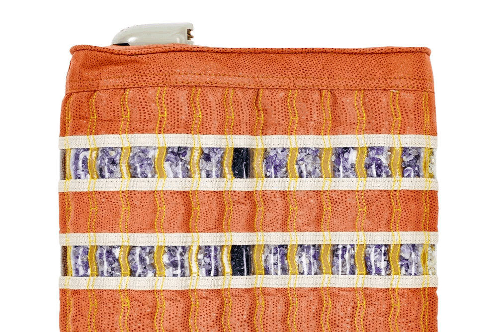 Close-up of amethyst, jade, obsidian and tourmaline crystal strips on the HealthyLine TAO Matrix PEMF Pillow for healing energy