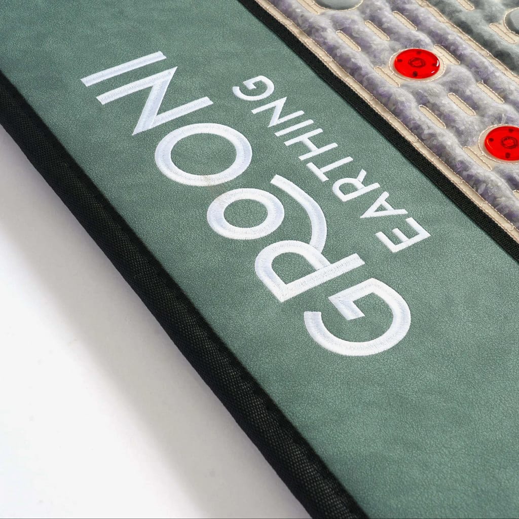 Grooni PEMF Mat review close-up of logo and mat surface texture