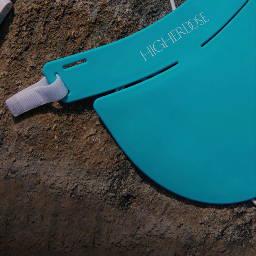 Close-up of HigherDose Neck Device adjustable strap system for secure and comfortable fit during therapy