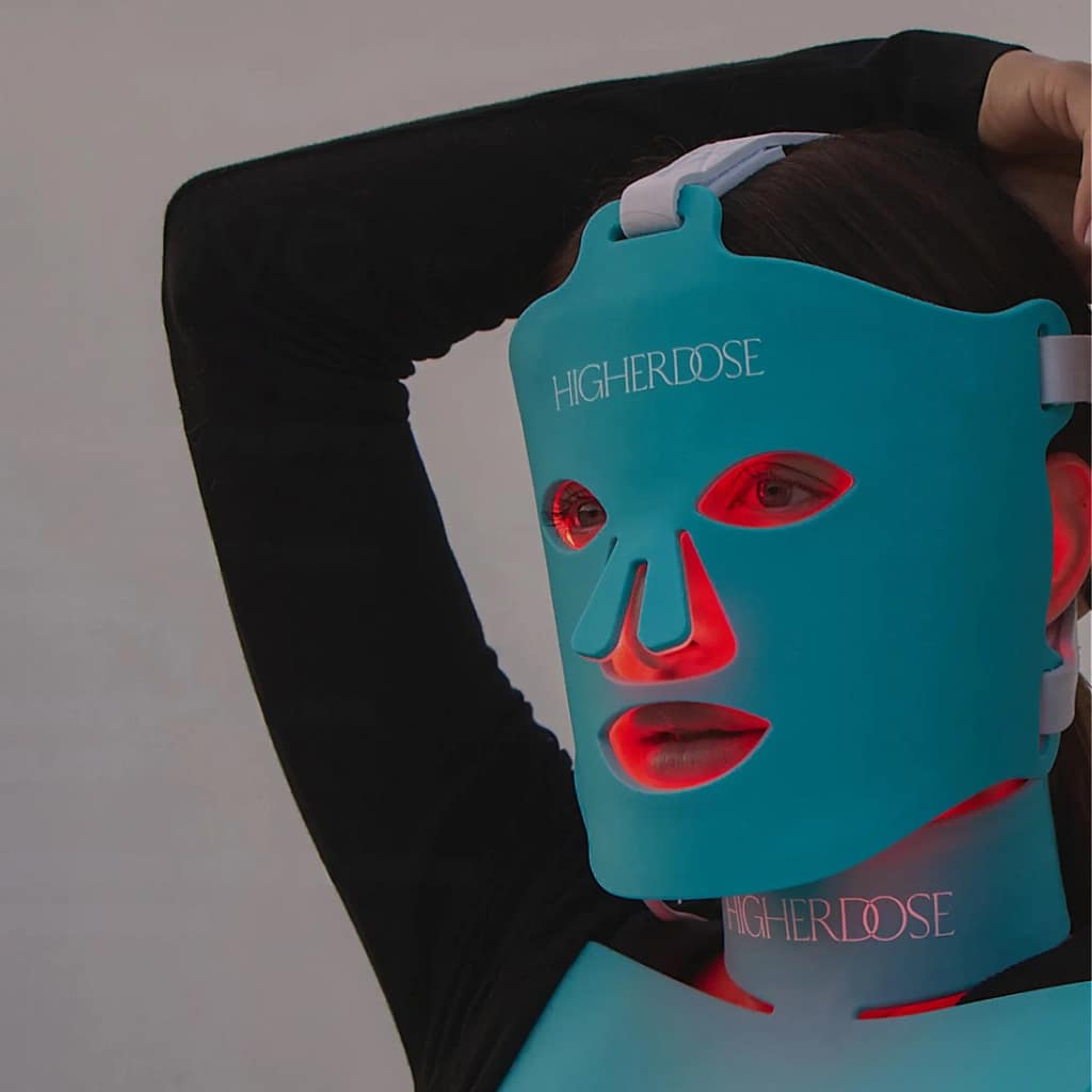 Woman experiencing HigherDose Red Light Therapy treatment for skin rejuvenation
