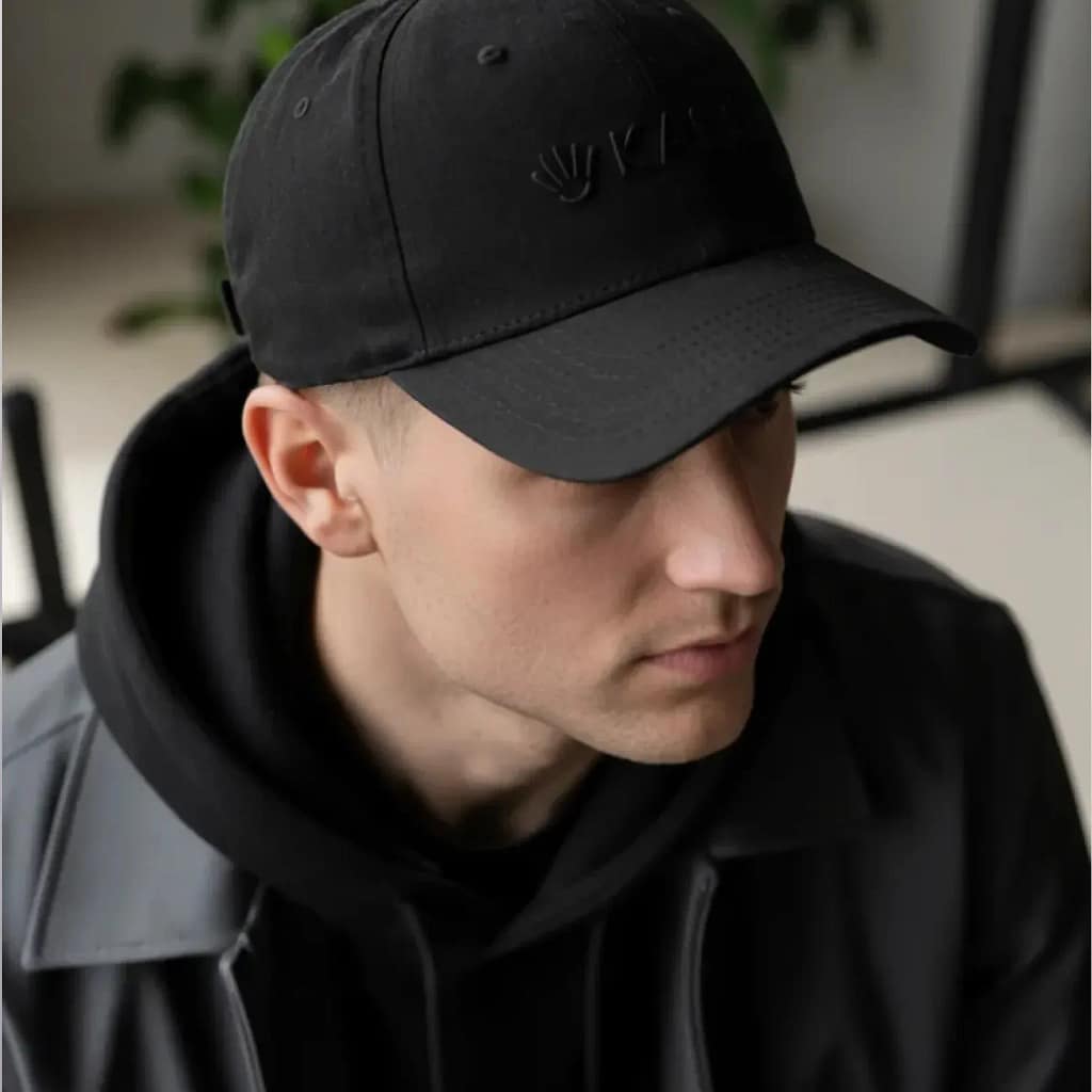 Man using Kala Red Light Therapy Hat for hands-free wireless LED scalp treatment session