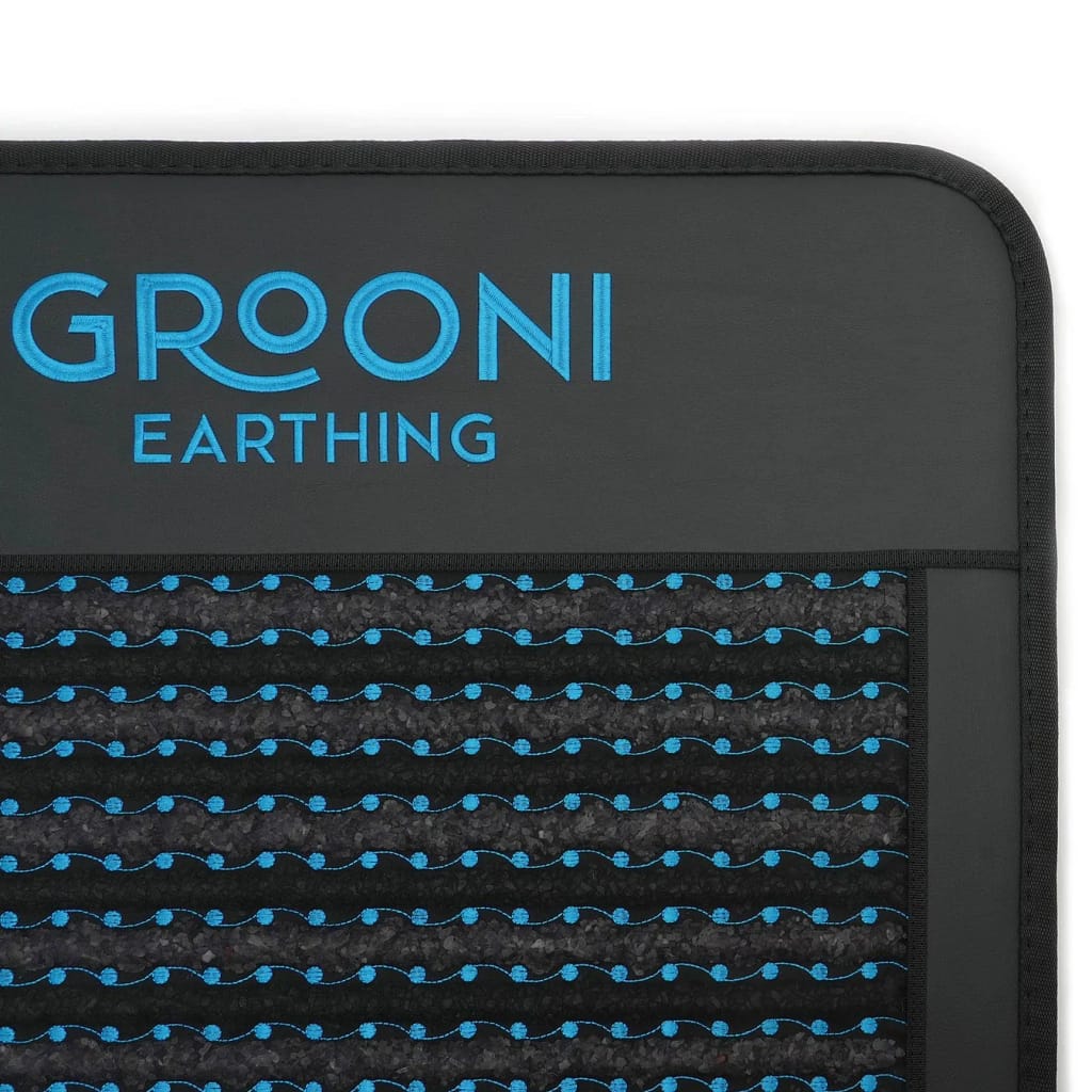 Close-up of Grooni PEMF mat showing logo and premium craftsmanship
