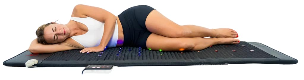 Woman relaxing on Hooga PEMF Mat for full-body healing, stress relief, and chakra rebalancing