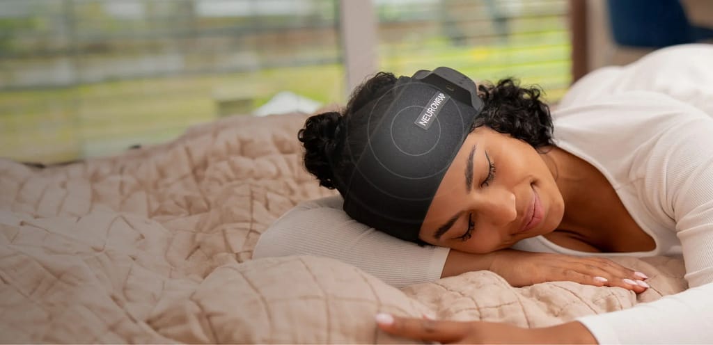 Person sleeping with Nushape Neurowrap Pulse Pro red light and PEMF wearable review