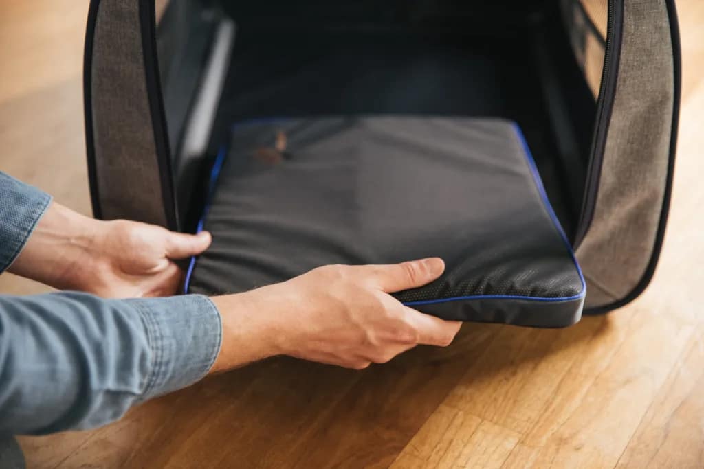 PetsPEMF pad for dogs being placed inside a dog house for at home PEMF therapy