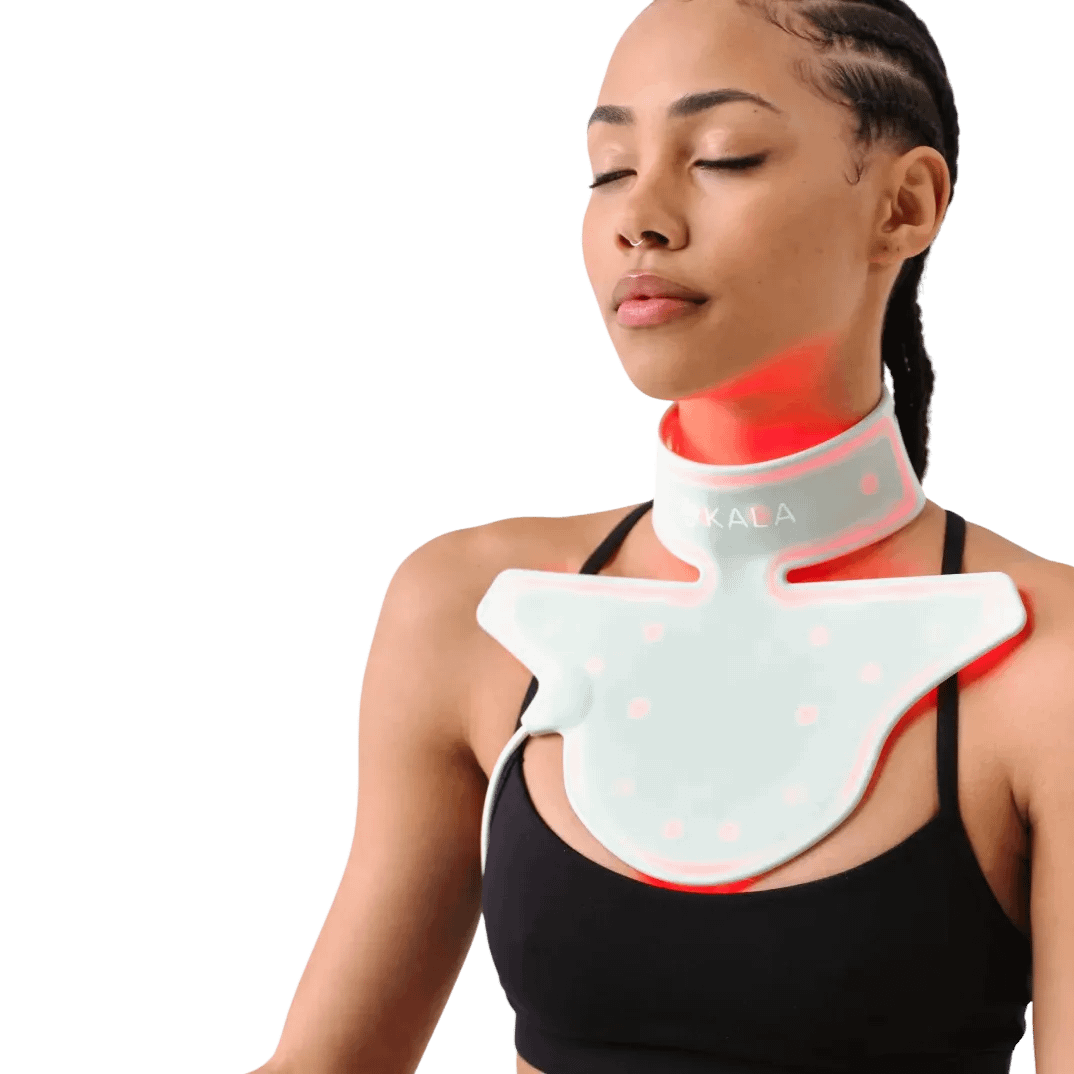 Woman in relaxation mode wearing Kala Red Light Therapy Neck Device for effortless anti-aging treatment
