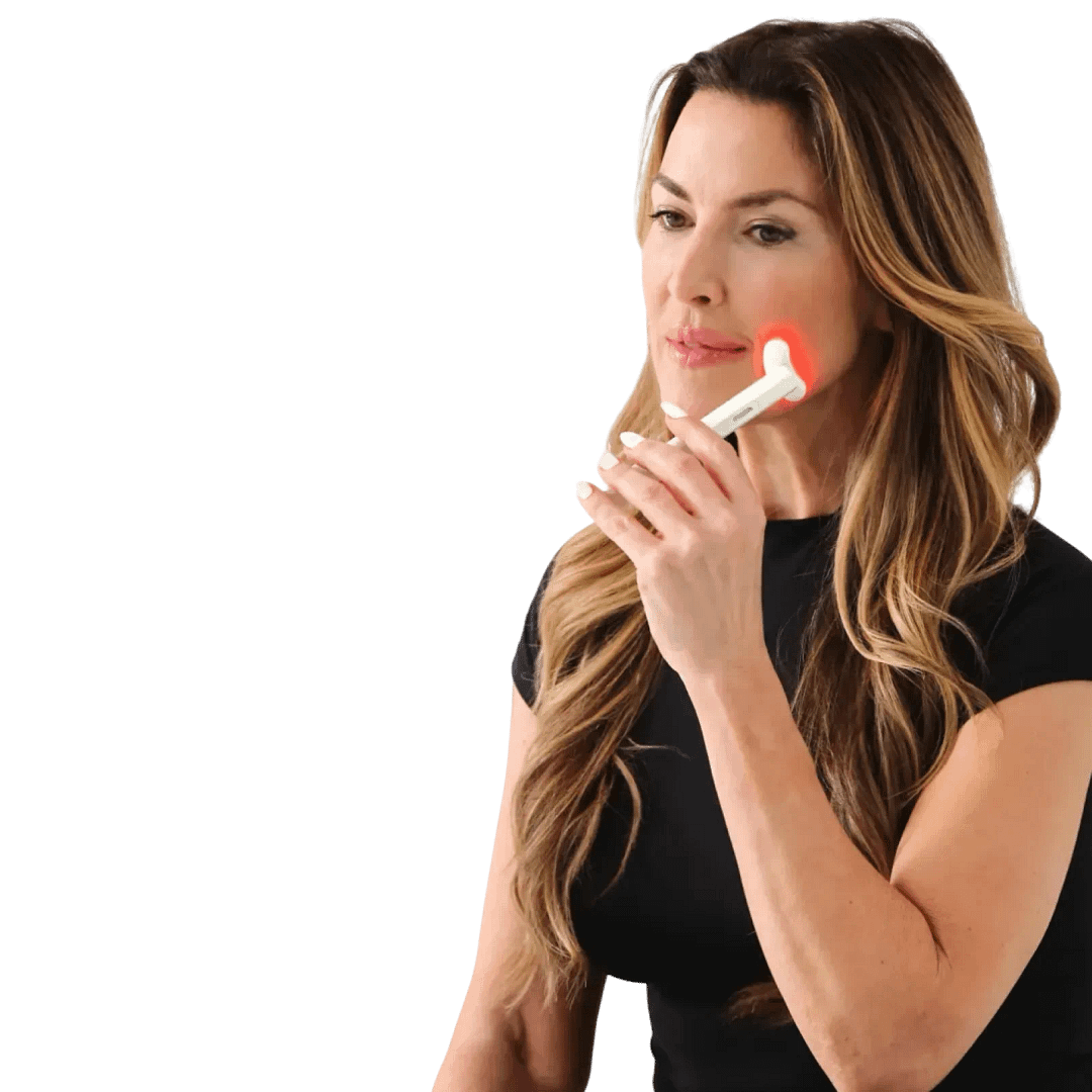 Woman using the Kala ed light therapy wand on her face, with red lights on