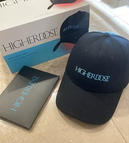 Complete HigherDose LED Hat package contents including wireless cap, power bank, and accessories