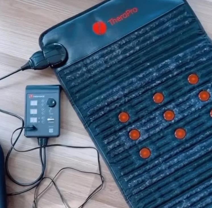 Therasage TheraPro PEMF Mat and controller on the ground – wellness setup for full-body PEMF therapy