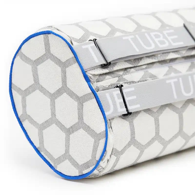 Straps on NeoRhythm Tube pillow for neck lumbar positioning