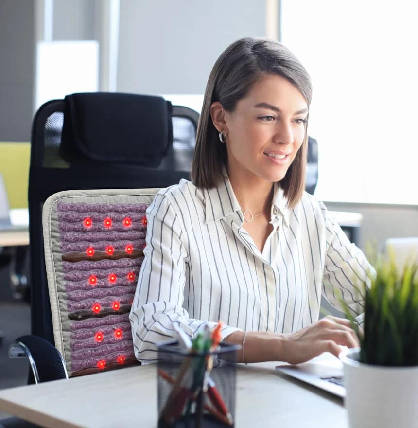 Professional using HealthyLine Platinum Chair PEMF Mat at desk for enhanced comfort and circulation