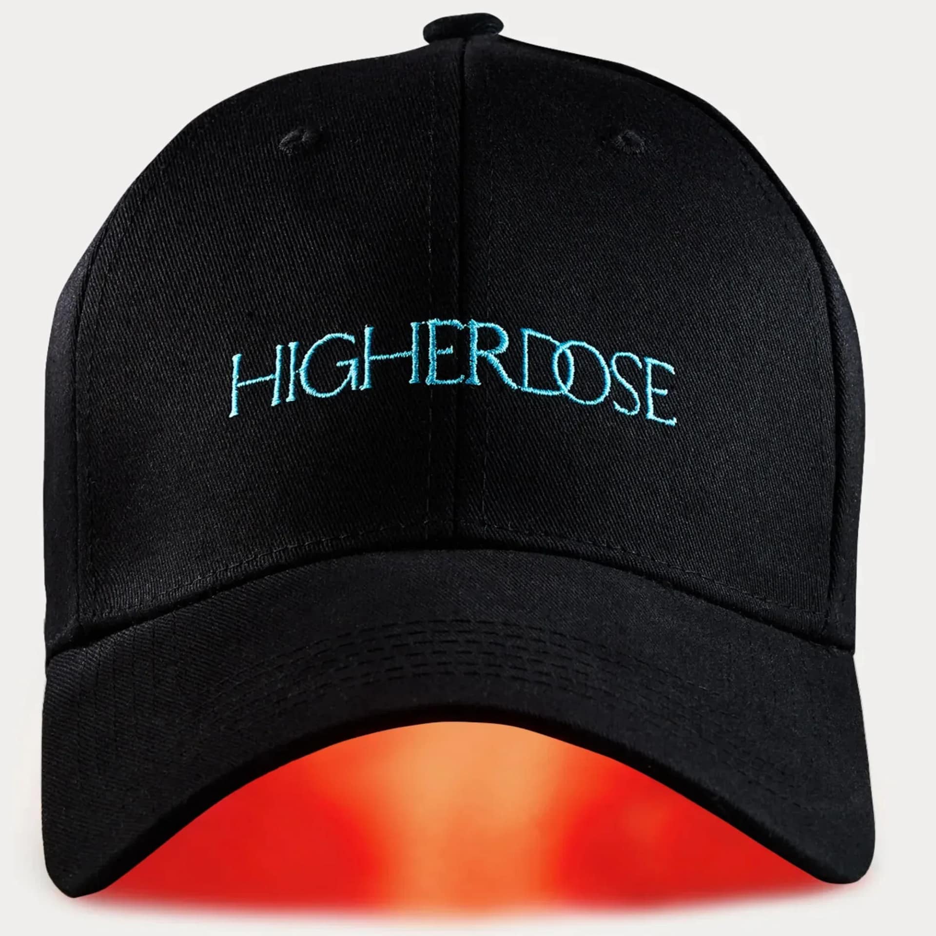 HigherDose wireless LED Hat illuminated showing battery-powered red light therapy in action
