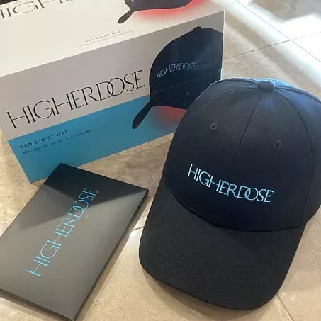 Complete HigherDose LED Hat package contents including wireless cap, power bank, and accessories