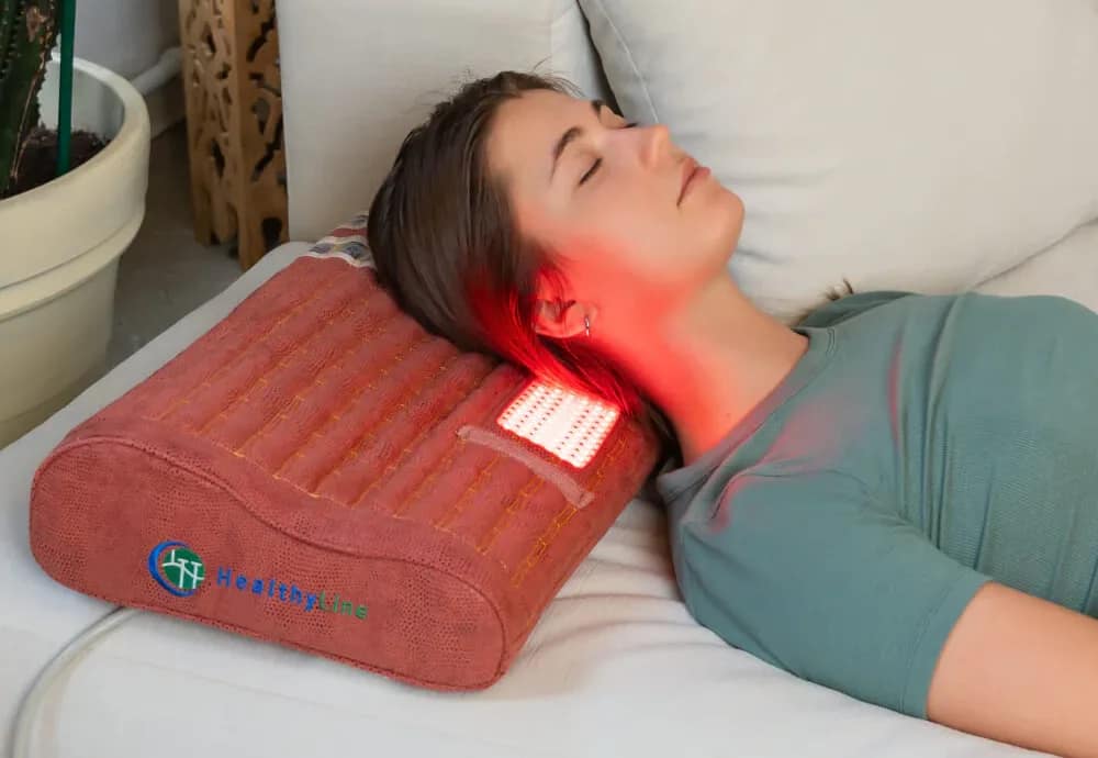 Woman experiencing neck support with gemstone therapy on the HealthyLine TAO Matrix PEMF Pillow